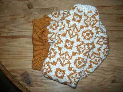 white and yellow mitten