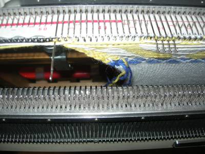 End needle in hold position